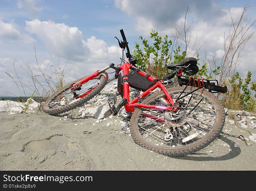 Red mountain bike on a sand hill. Red mountain bike on a sand hill