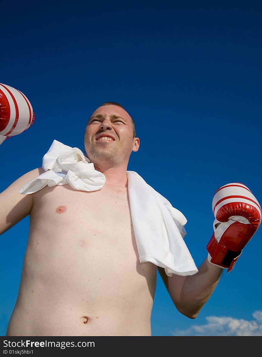 Boxer over blue sky background photo