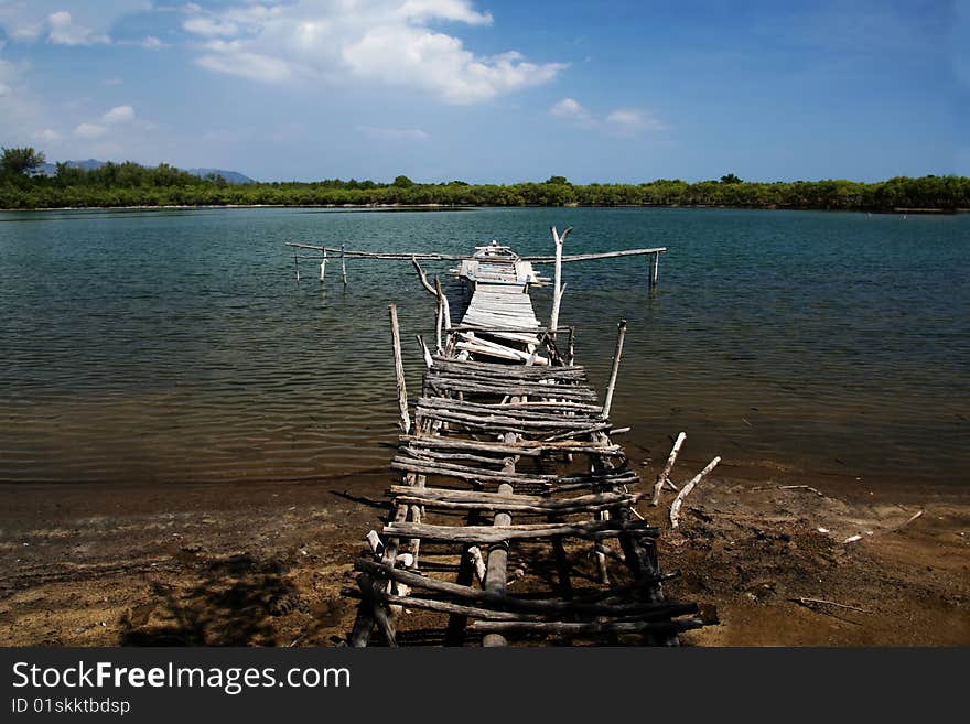 Old bridge near the lake in the center on Meno Island