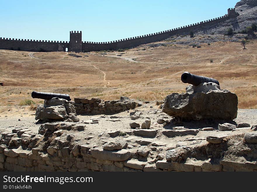 View to the Genoese fortress in Sudak, wall and two cannons, Ukraine. View to the Genoese fortress in Sudak, wall and two cannons, Ukraine