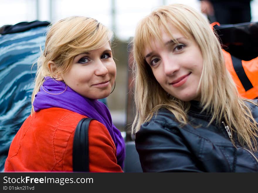 Two beautiful smiling friends girls. Two beautiful smiling friends girls