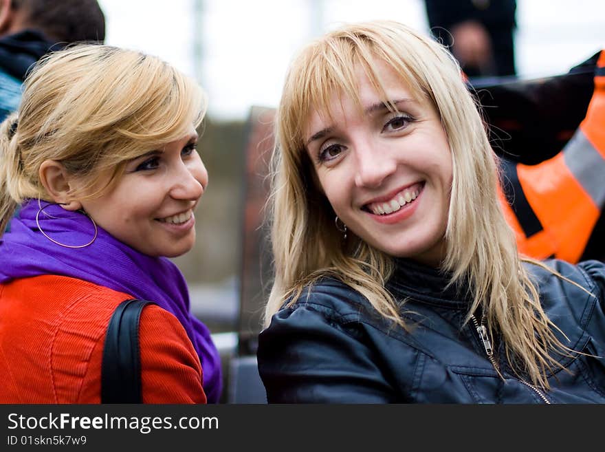 Two beautiful smiling friends girls. Two beautiful smiling friends girls