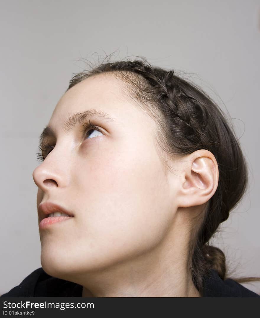 Close up profile portrait of young starry-eyed woman. Close up profile portrait of young starry-eyed woman