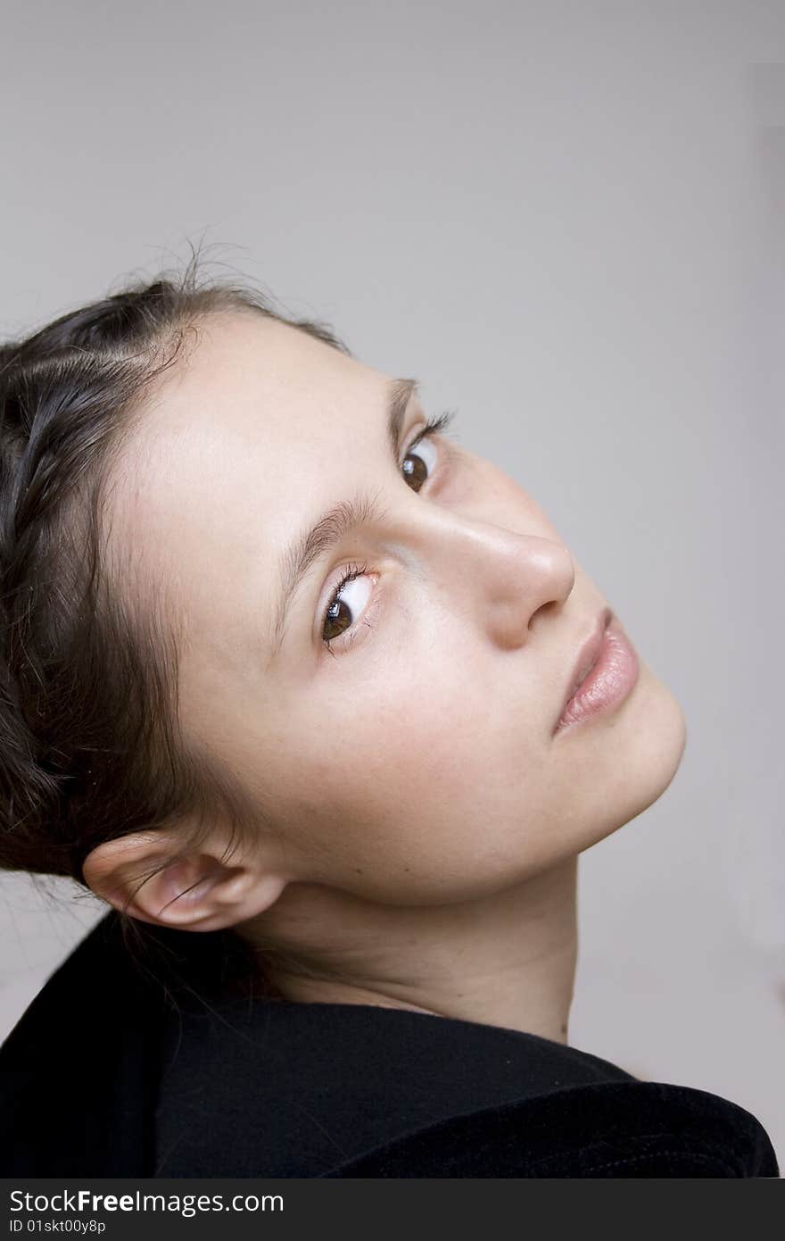 Close up half-face portrait of young woman. Close up half-face portrait of young woman