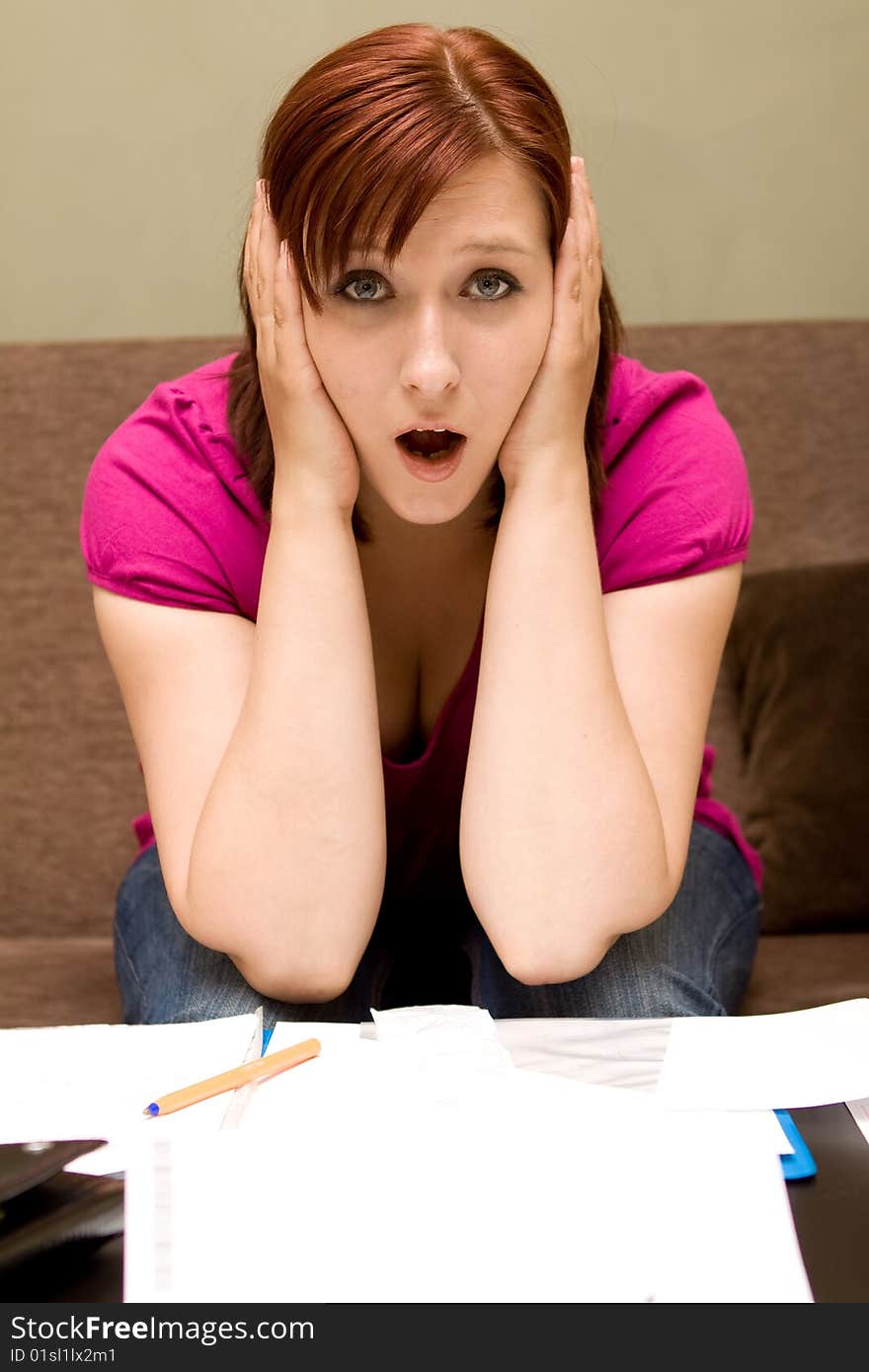 Woman with bills on sofa