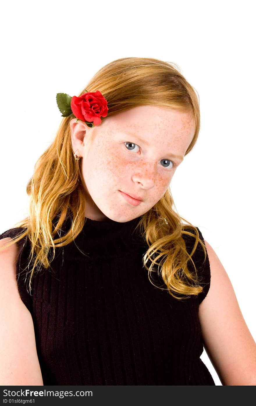 Pretty girl with red rose in her hair