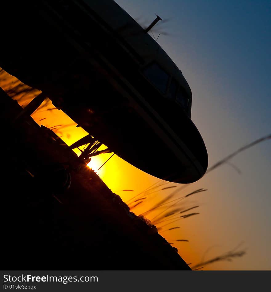 Aircraft Silhouette against setting sun. Aircraft Silhouette against setting sun