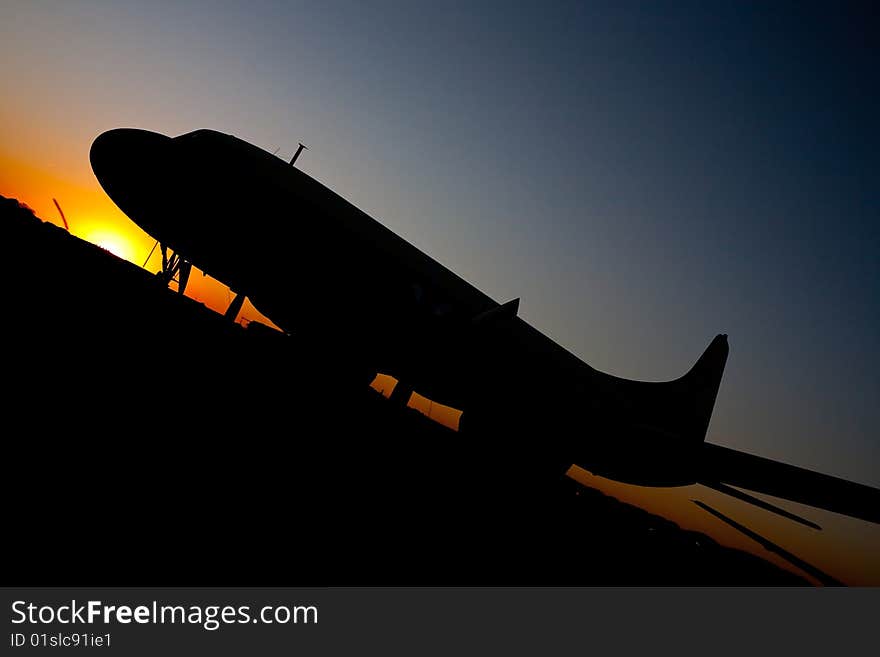 Aircraft Silhouette against setting sun. Aircraft Silhouette against setting sun