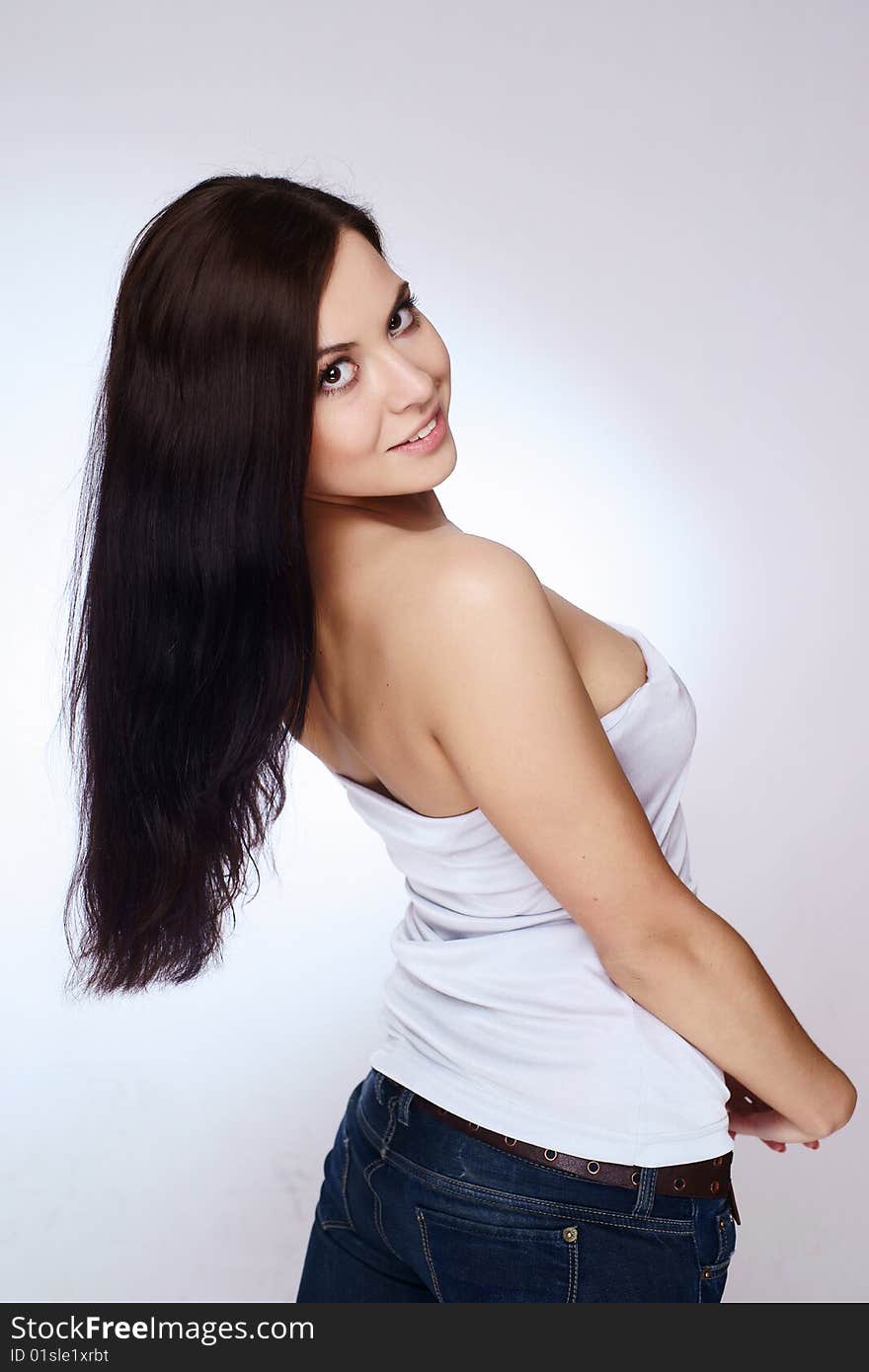 Portrait of beautiful young woman with luxuriant healthy long hair