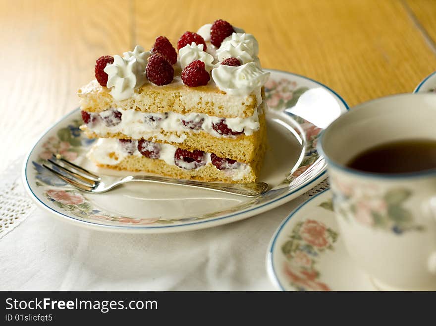 Raspberry cake served with  tea. Raspberry cake served with  tea