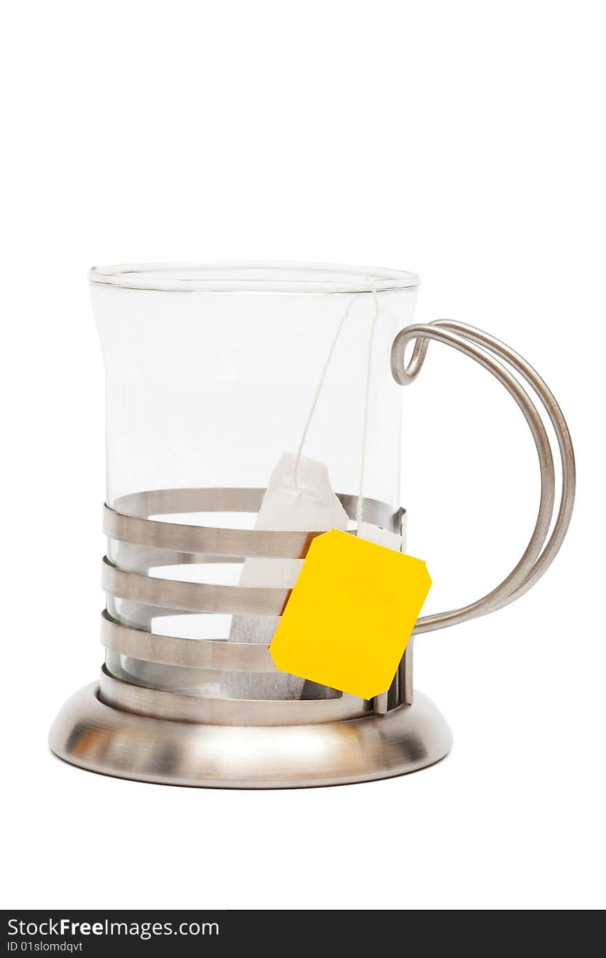 Teabag in a glass with a cup holder on a white background