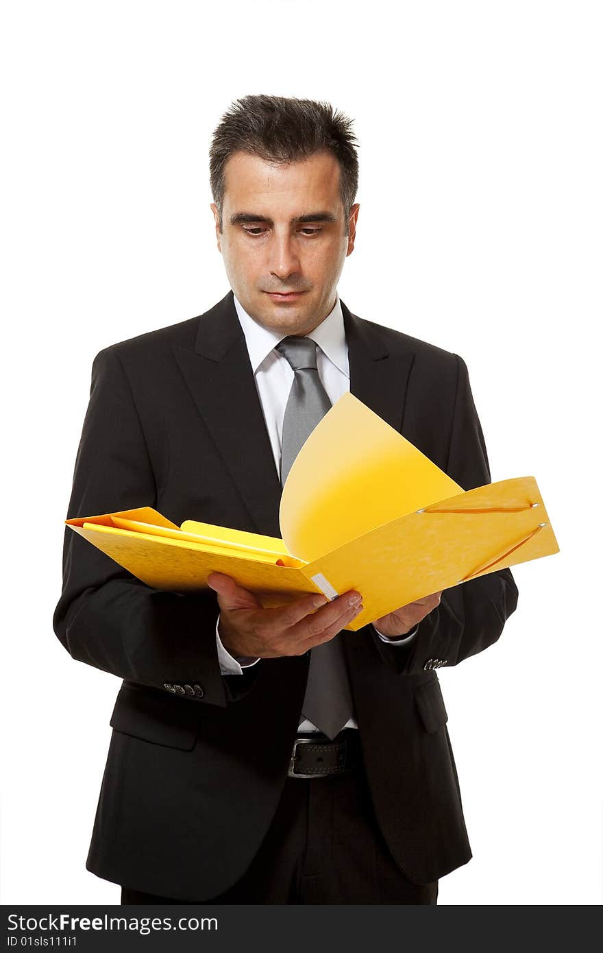 Businessman holds a yellow file from his office