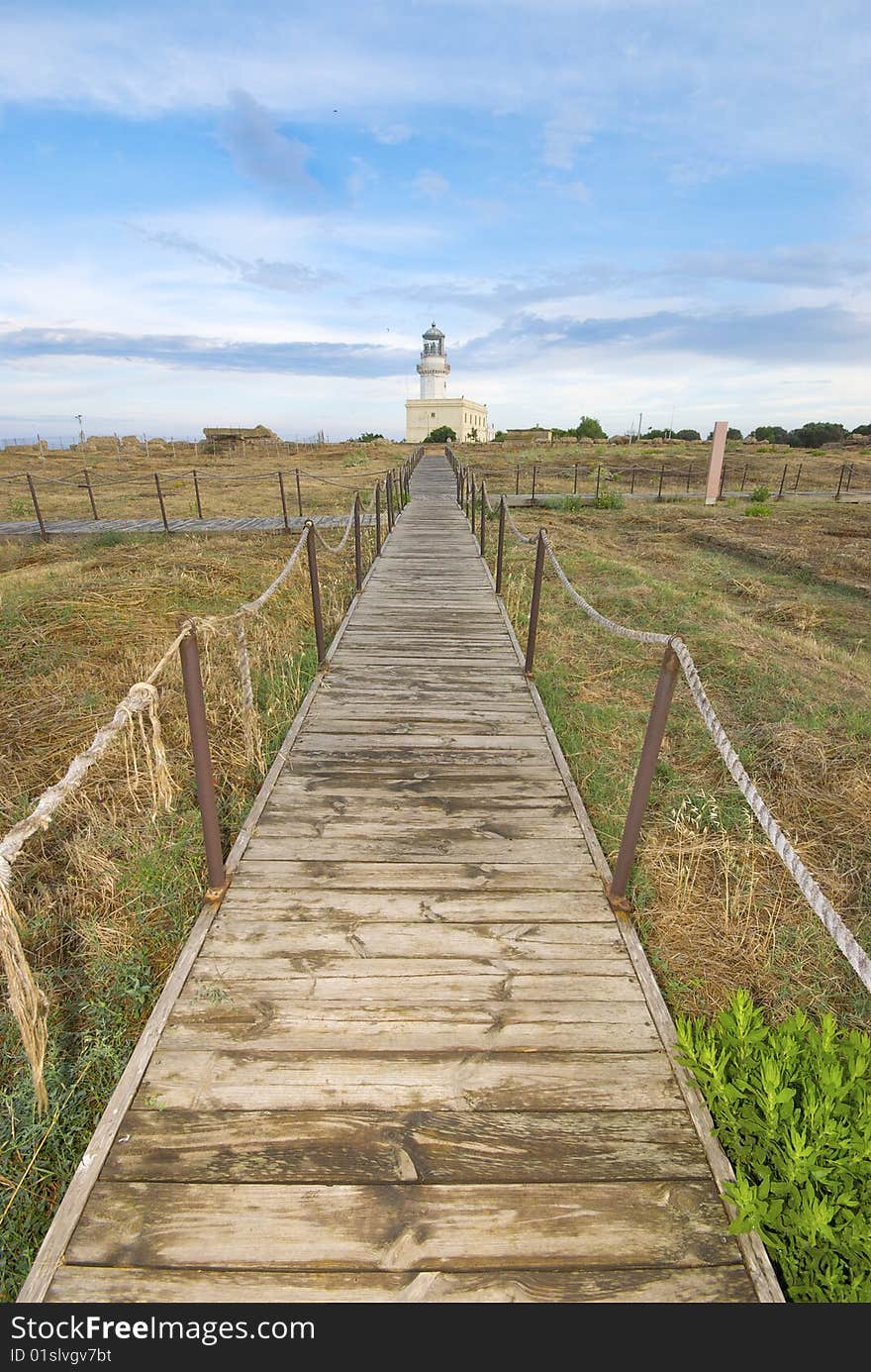 Lighthouse in mediterranean landscape