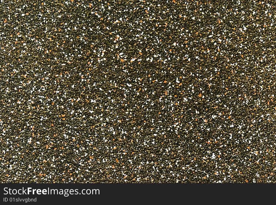 The dark texture from small white green and black stones. The dark texture from small white green and black stones