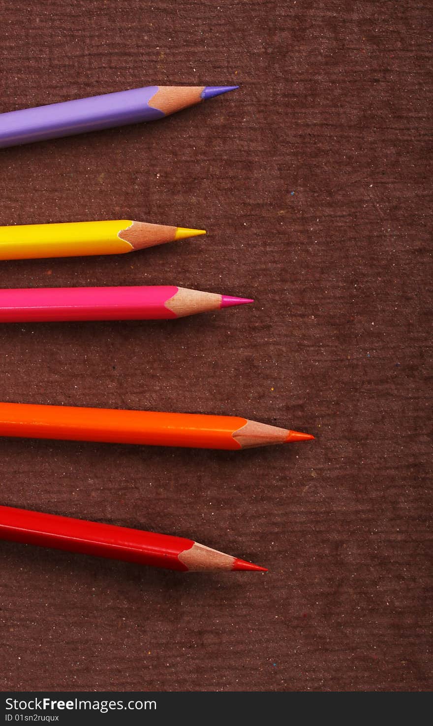 Multicolored pencils with handmade paper