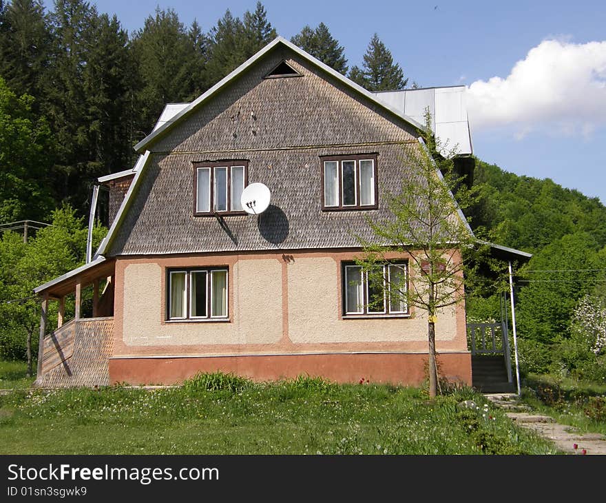 House on a background of a wood.