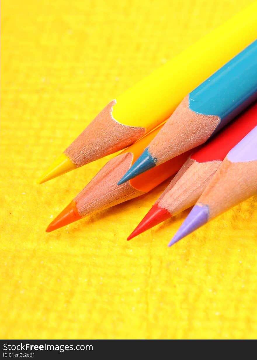 Multicolored pencils with handmade paper