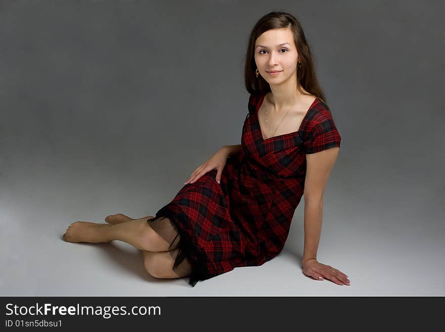 Young beautiful woman in dress posing