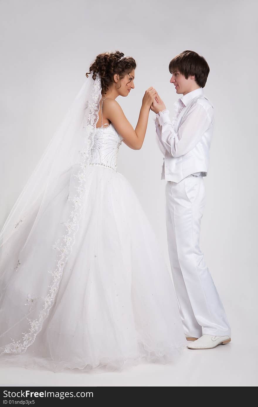 Young woman and man in a wedding clothing. Young woman and man in a wedding clothing