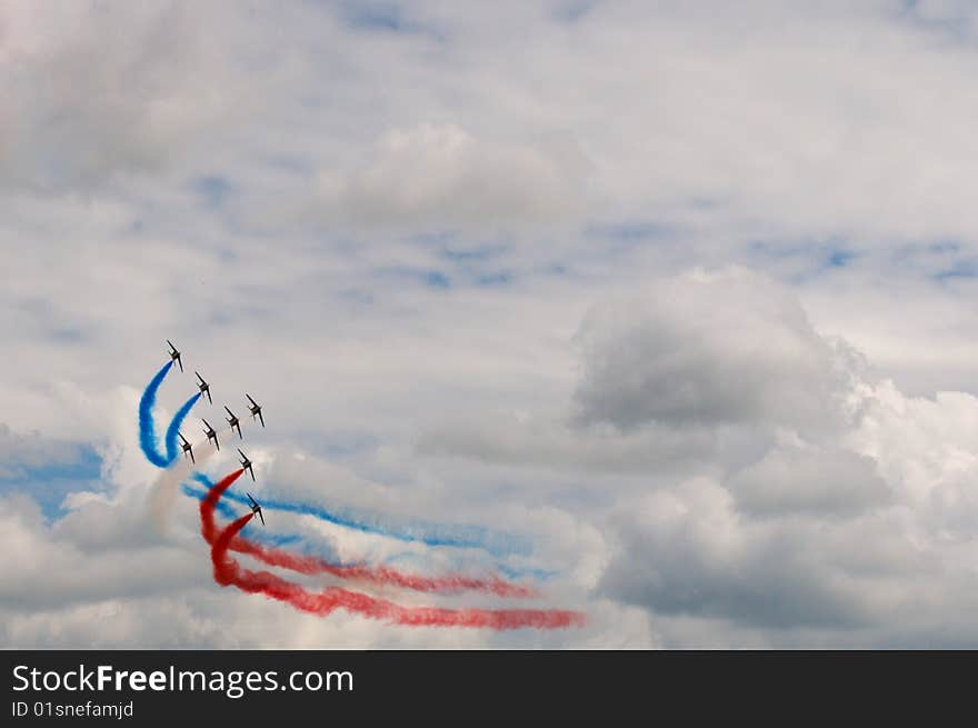 A jet aerobatic display team sweep round. A jet aerobatic display team sweep round