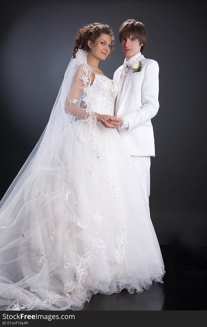 Young woman and man in a wedding clothing. Young woman and man in a wedding clothing