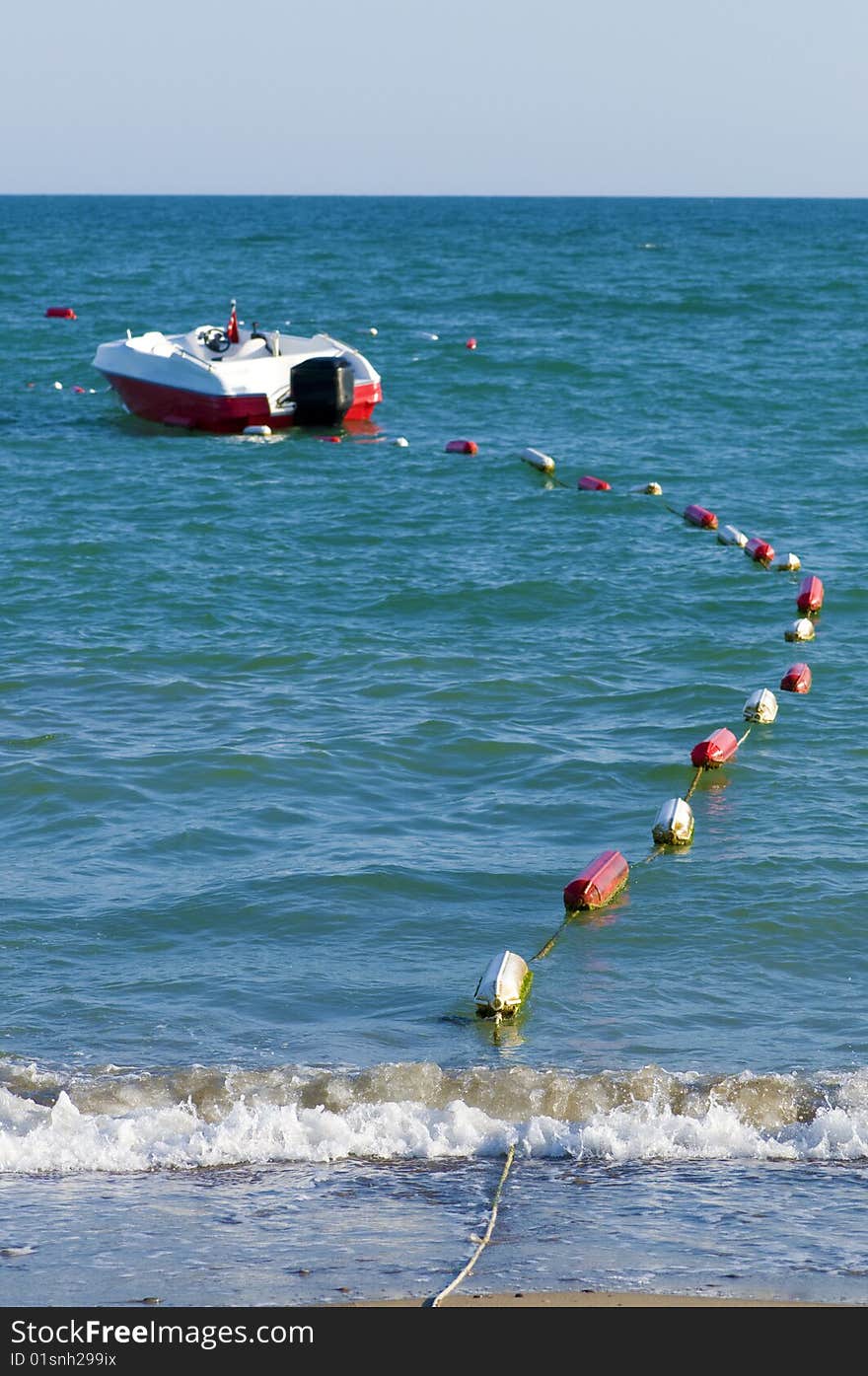 Motor boat and float on sea