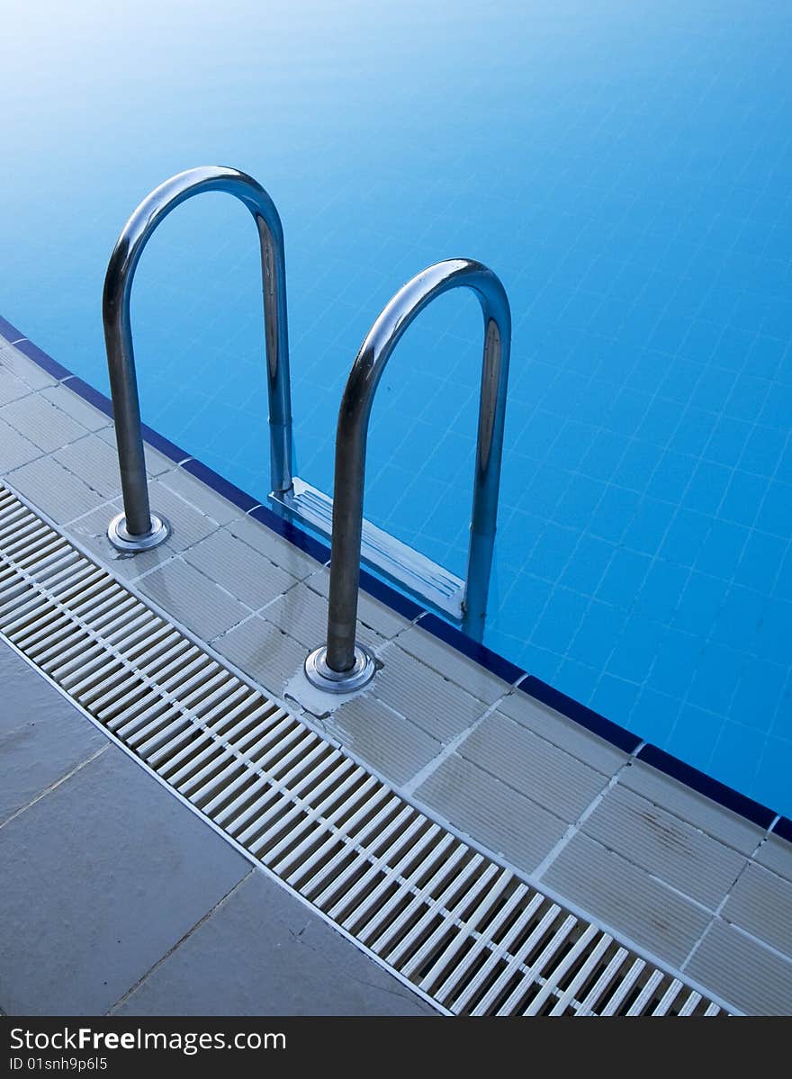 Blue water pool stair detail