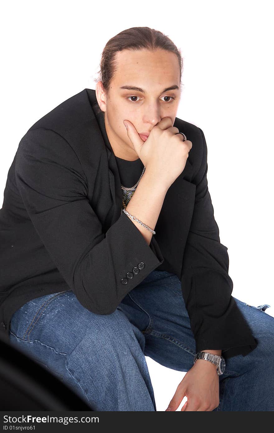 Young man with long hair is thinking hard. Isolated over white.