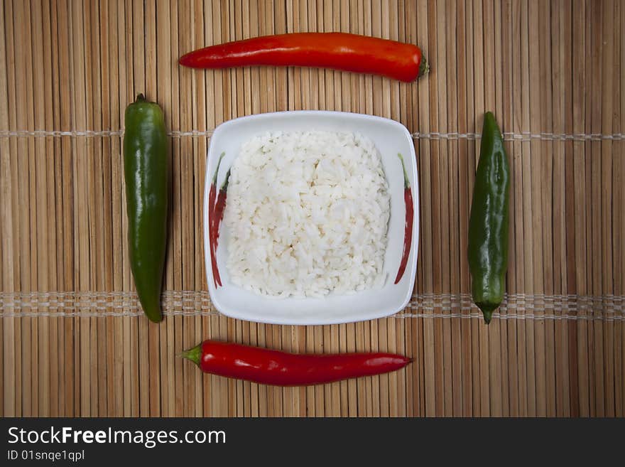 A bowl of perfectly cooked, plain Basmati rice, in an Asian style bowl, with a garnish of Thai Basil. A bowl of perfectly cooked, plain Basmati rice, in an Asian style bowl, with a garnish of Thai Basil