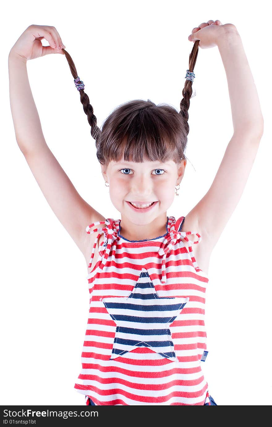 Little cute girl hold her pig tails, studio shot