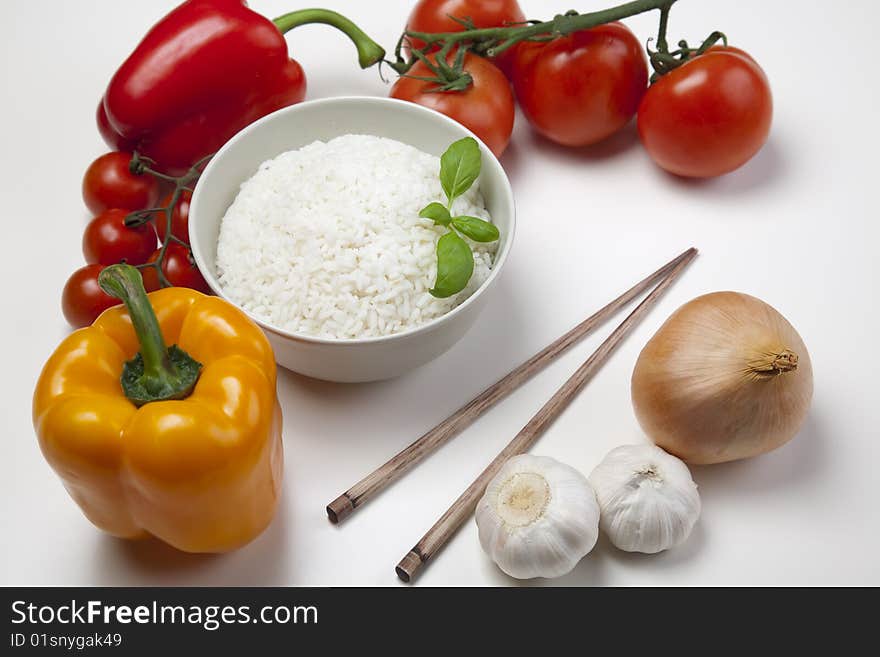 A bowl of perfectly cooked, plain Basmati rice, in an Asian style bowl, with a garnish of Thai Basil. A bowl of perfectly cooked, plain Basmati rice, in an Asian style bowl, with a garnish of Thai Basil