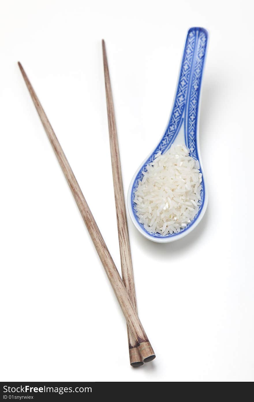 A bowl of perfectly cooked, plain Basmati rice, in an Asian style bowl, with a garnish of Thai Basil. A bowl of perfectly cooked, plain Basmati rice, in an Asian style bowl, with a garnish of Thai Basil