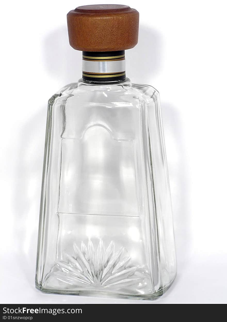 Empty transparent glass bottle with a cork