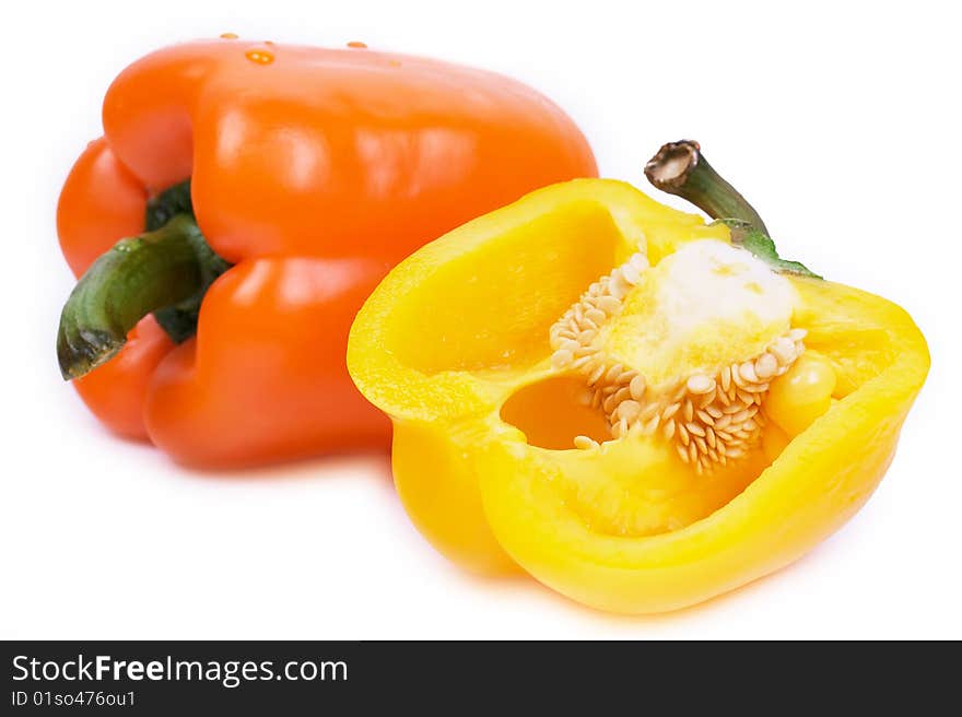 Closed-up yellow pepper and cut pepper isolated on white background. Closed-up yellow pepper and cut pepper isolated on white background