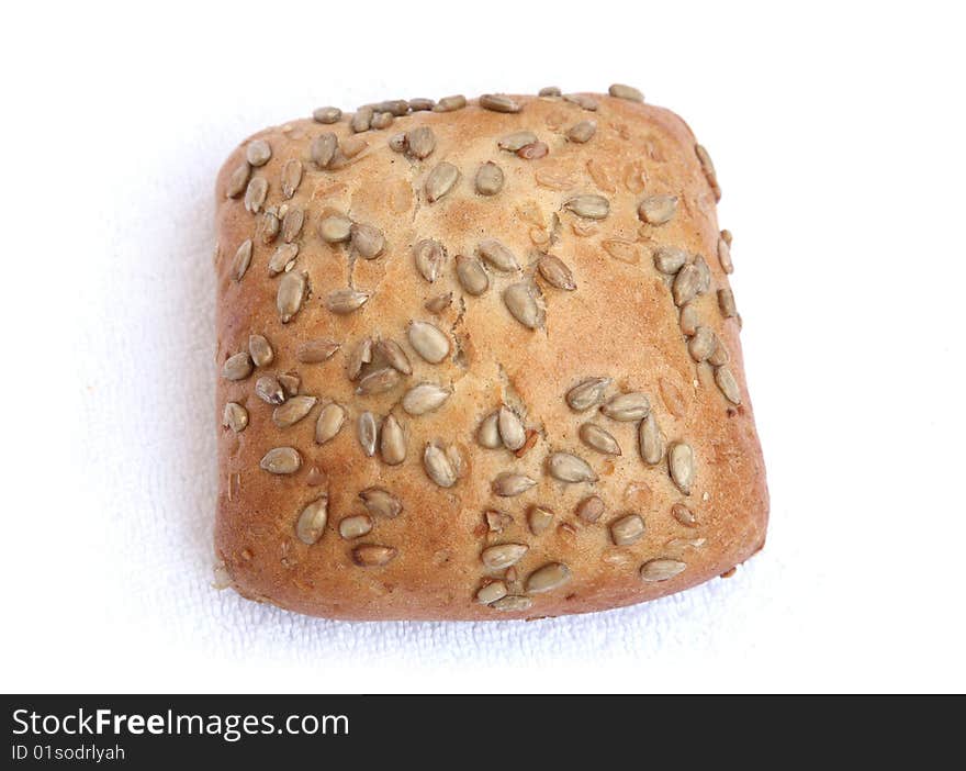 Roll with sunflower seeds isolated on a white background