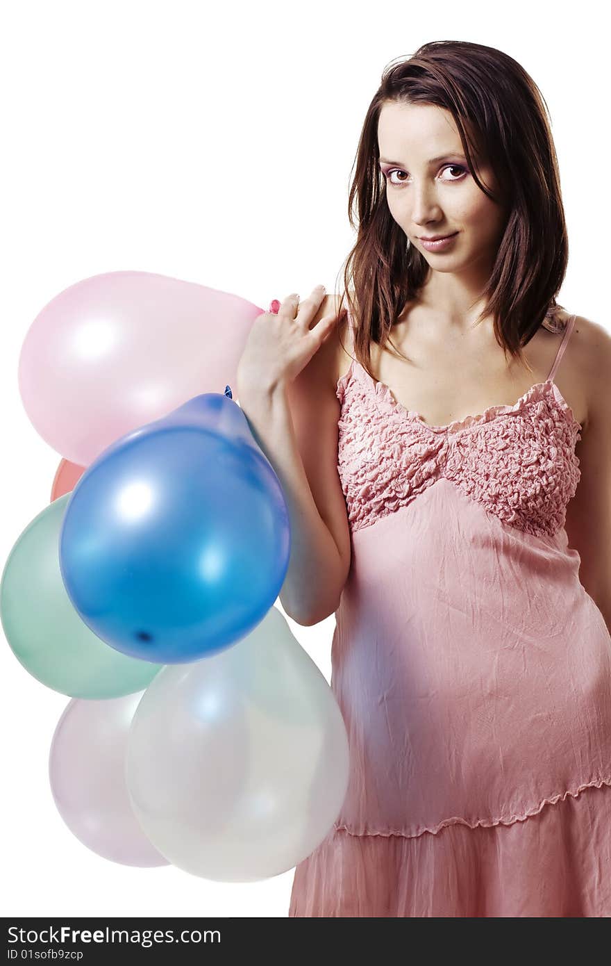 Smiling girl holding balloons