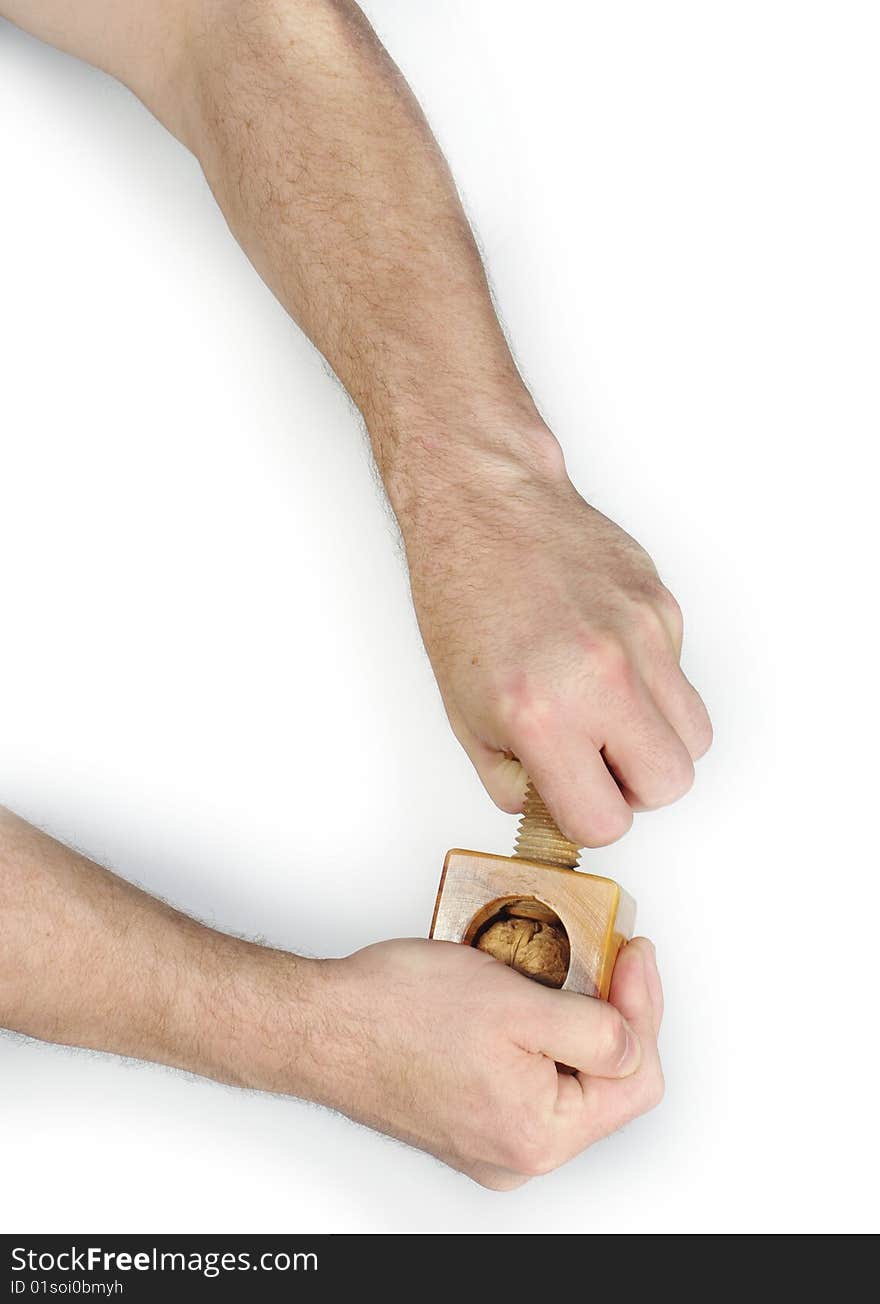 Splitting nuts wooden nutcracker on white background