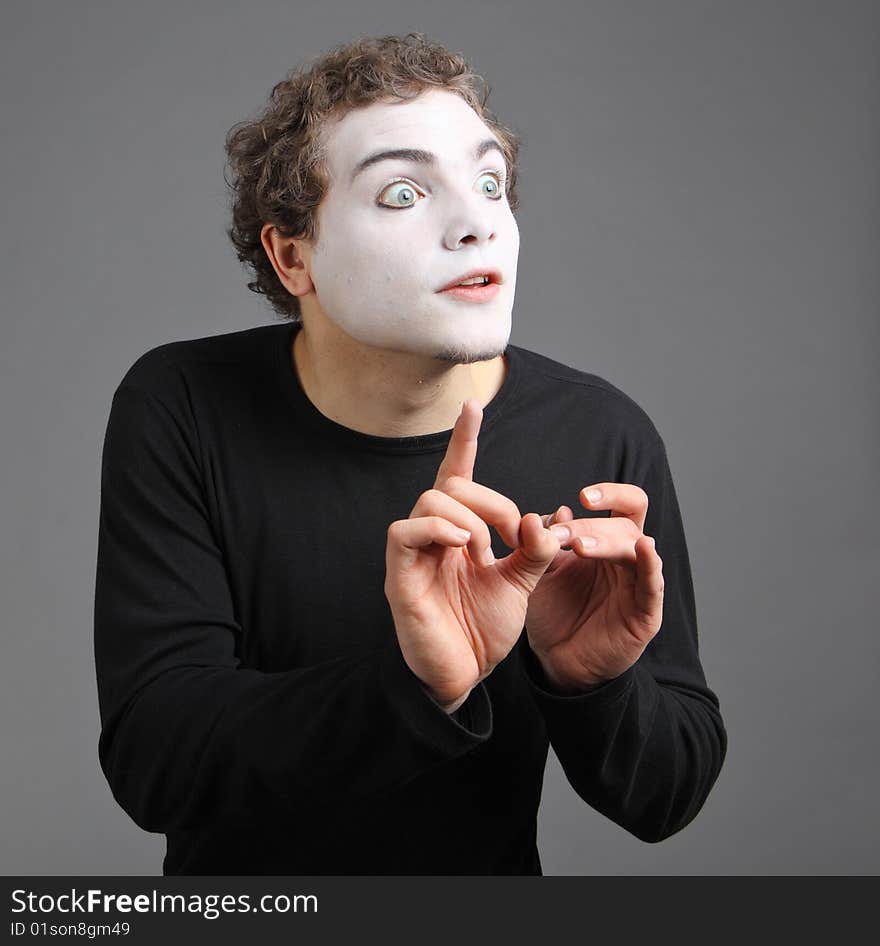 Portrait of the mime isolated on grey background