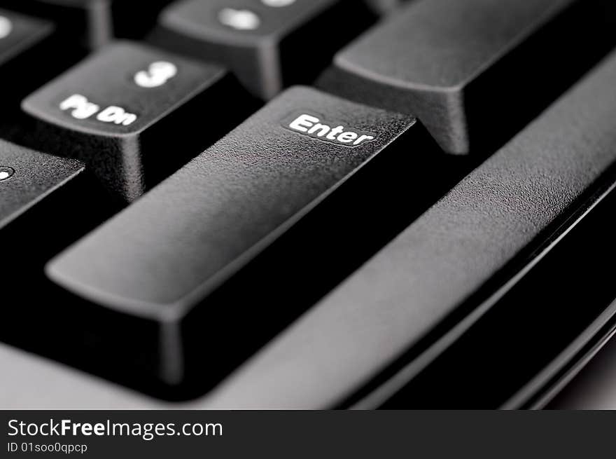 Macro of an Enter key on a black keyboard