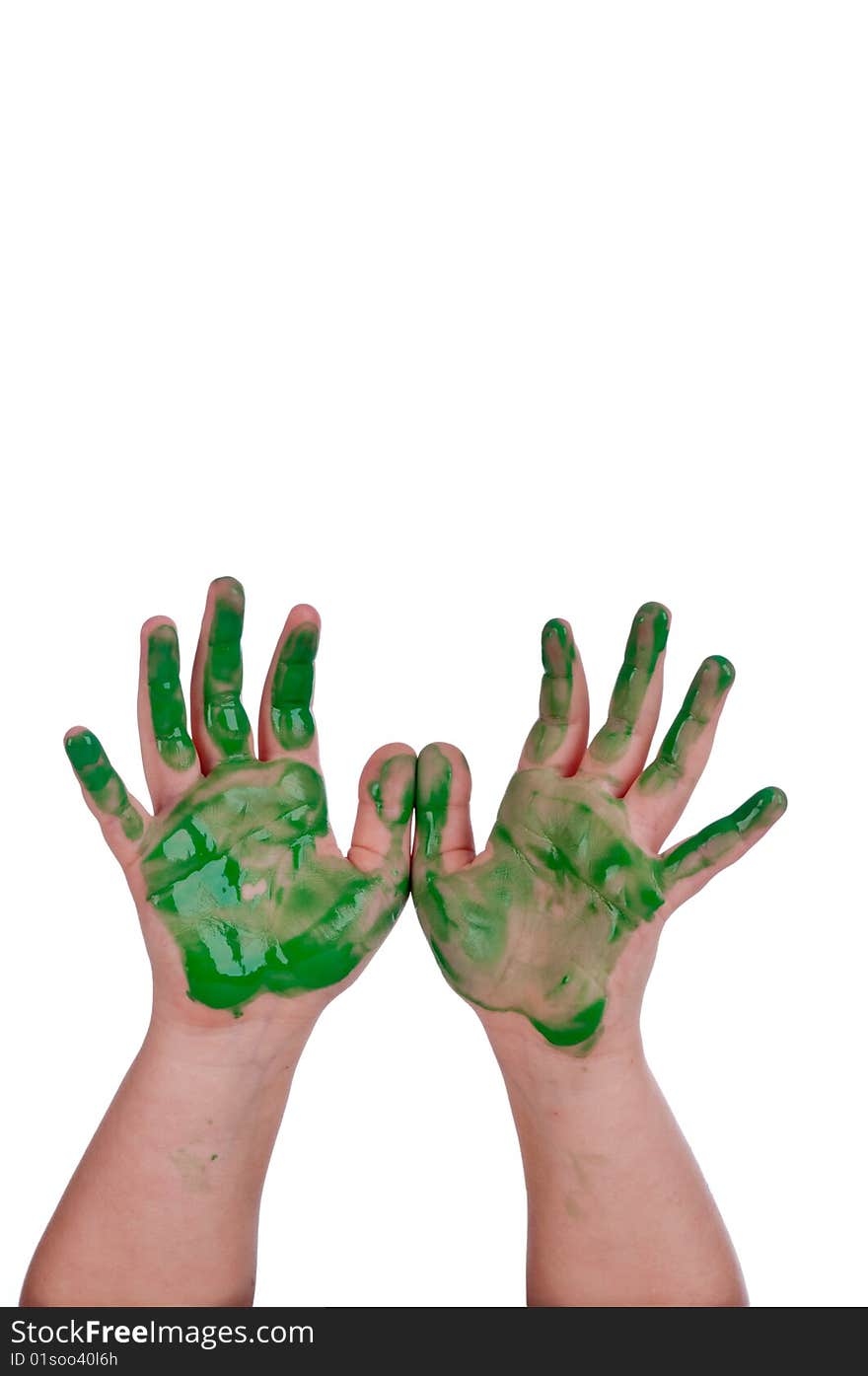 A vertical image of a child's hands with green paint on white with copy space