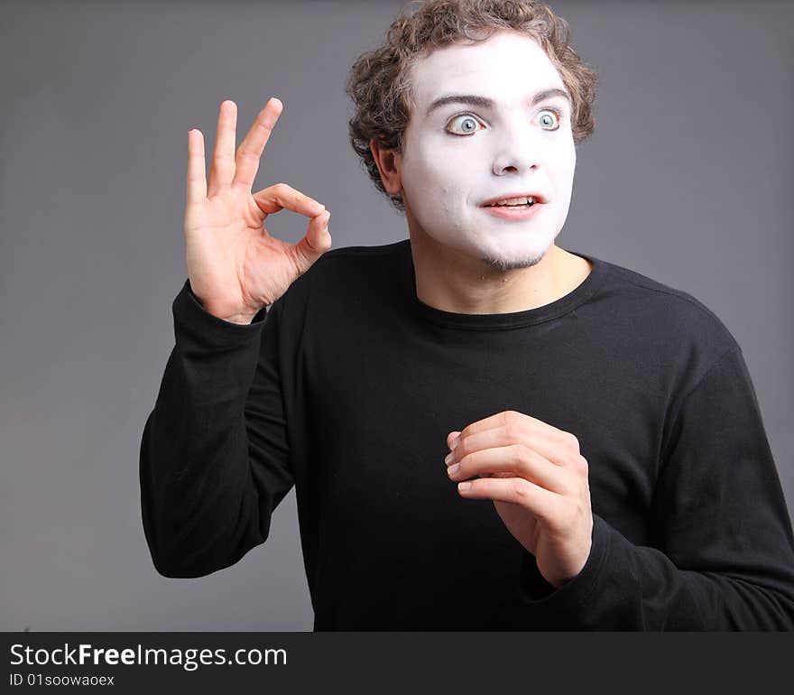 Portrait of the mime isolated on grey background