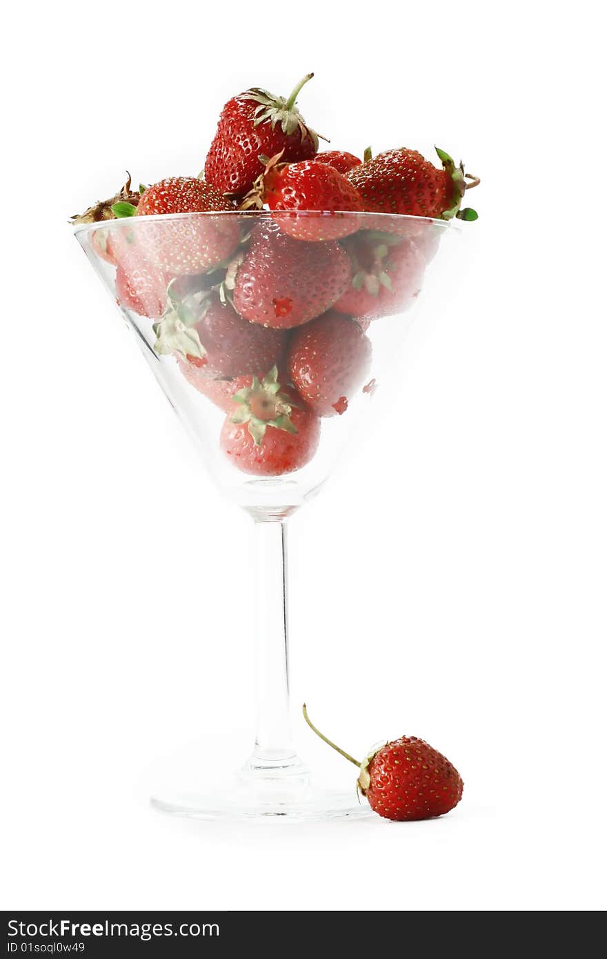 Strawberry in the glass on a white background. Strawberry in the glass on a white background