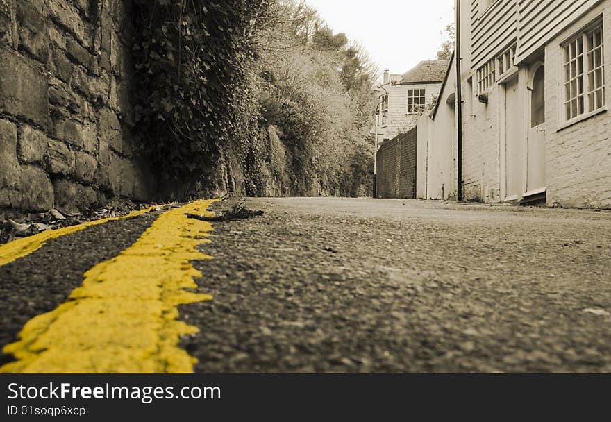 Old gravel road with yellow stripe. Old gravel road with yellow stripe