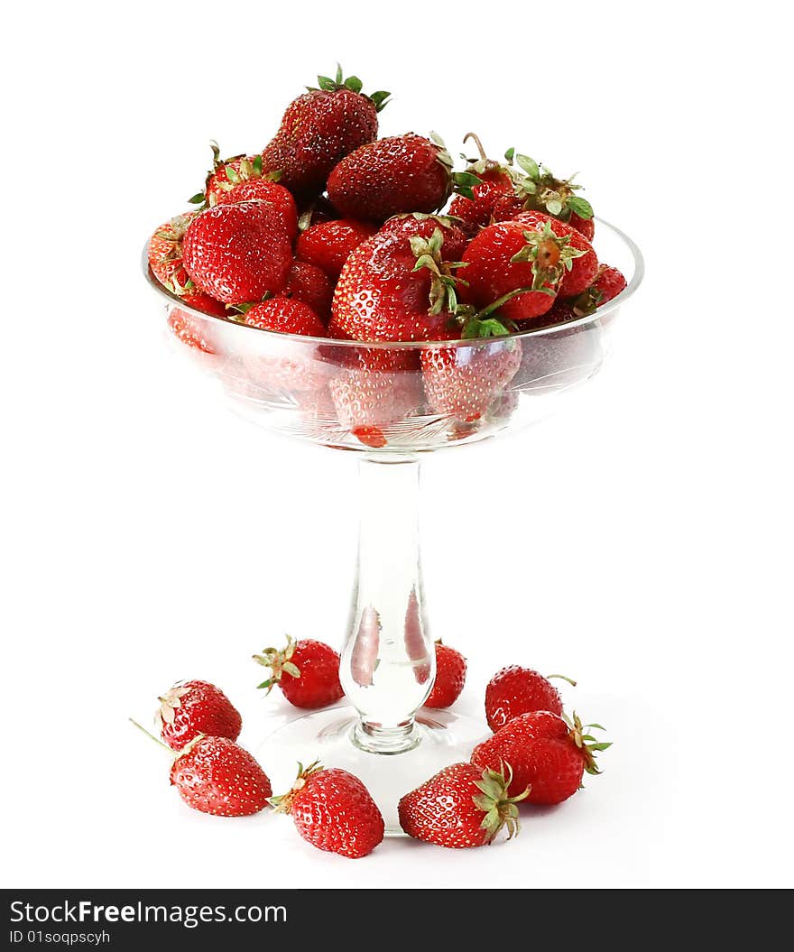 Strawberry in the glass on a white background. Strawberry in the glass on a white background