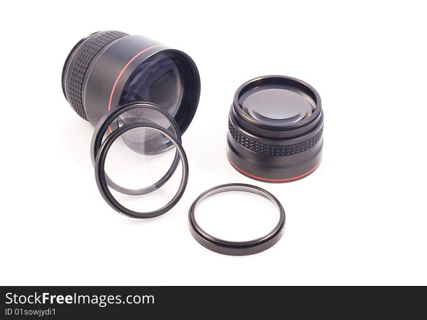 A number of photographic add-on lenses against a white background