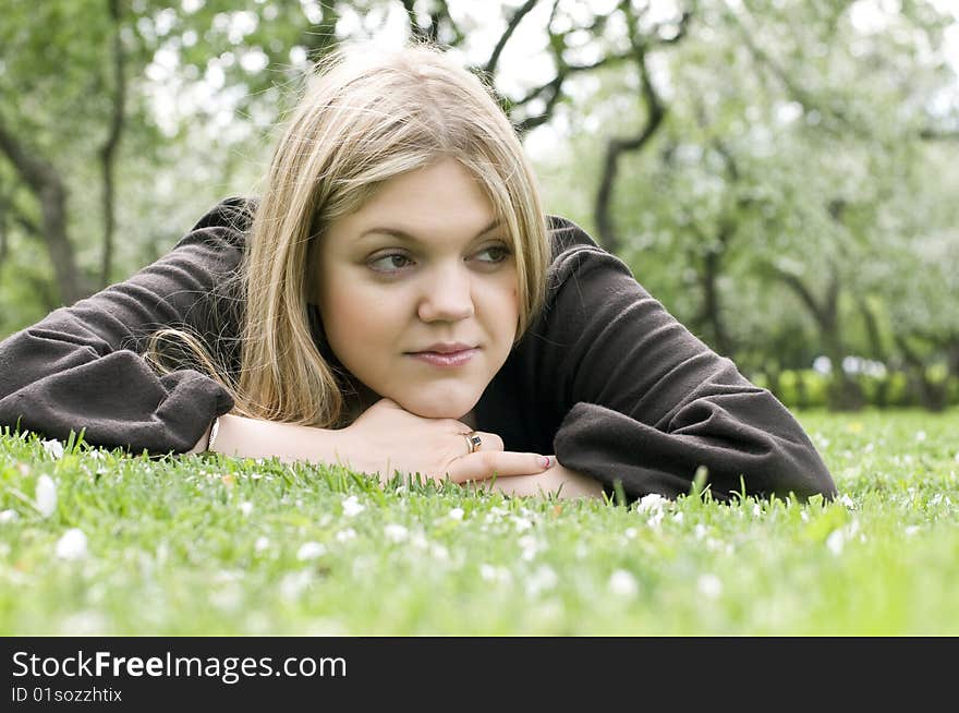 Beautiful woman laying on the grass