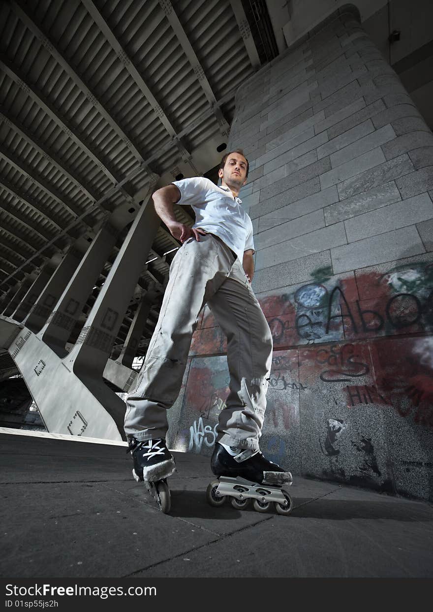 Wide angle photo of a rollerskater in urban scenery