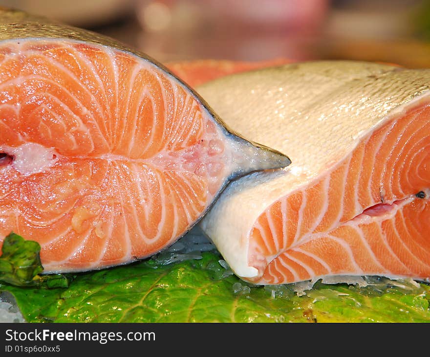 Close up of two half salmons in a market. Close up of two half salmons in a market