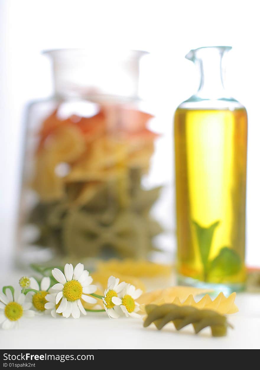 Pasta with oil bottle and camomile