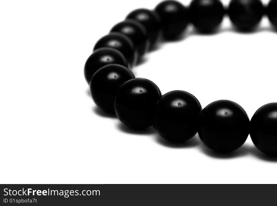 Black beads isolated on white background